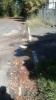 Road and gutter falling apart in front of premises